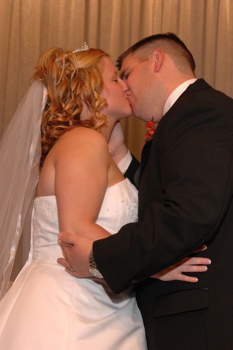 1985 Ford Crown Victoria LTD - A newly married couple shares a kiss on their wedding day.