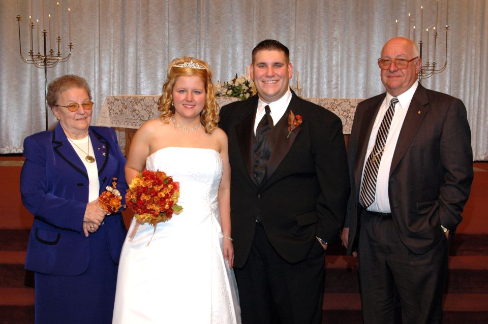 Wedding party posing for a photo indoors