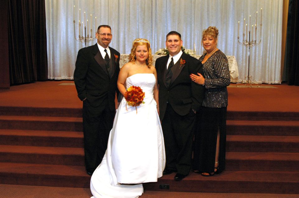Wedding party posing on church steps