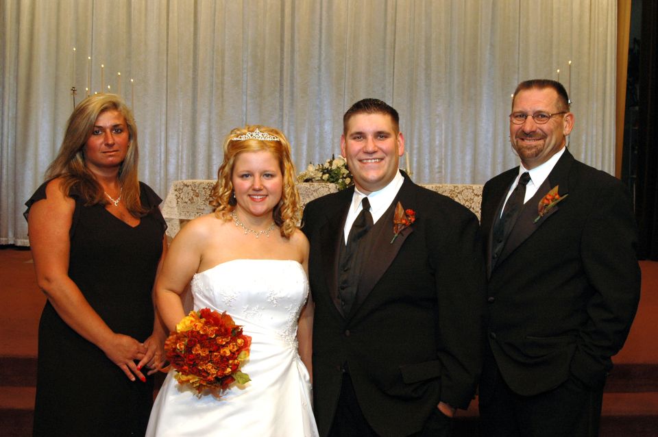 Wedding party posing for a photo indoors