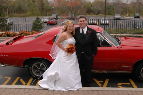 1985 Ford Crown Victoria LTD - Bride and groom pose with a red 1967 Pontiac GTO on their wedding day.