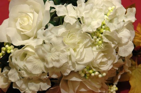 1985 Ford Crown Victoria LTD - A bouquet of white flowers, possibly for a wedding, is shown in a close-up view.