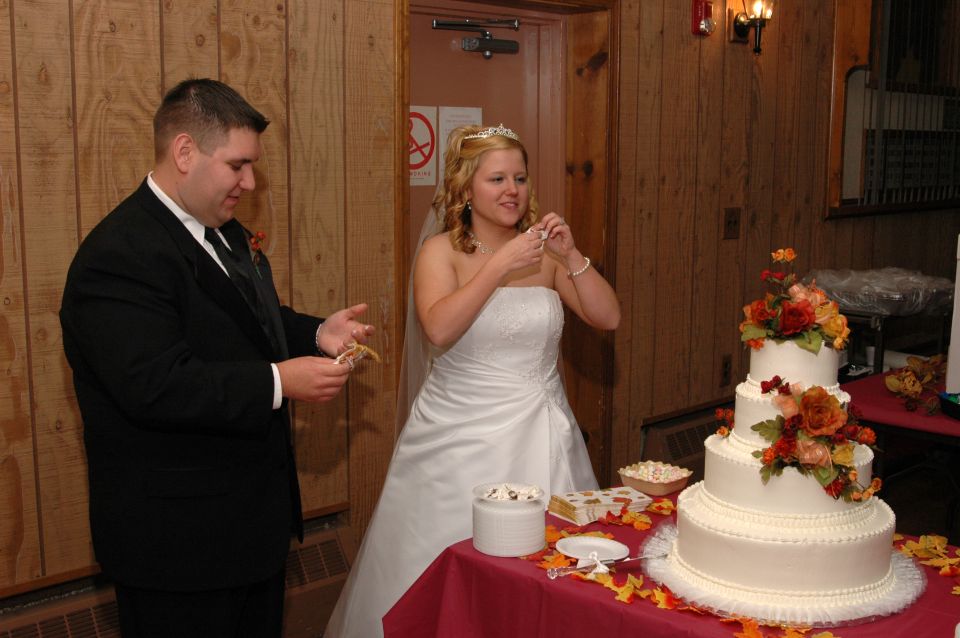 Bride and groom cutting a wedding cake