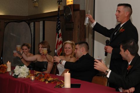 1985 Ford Crown Victoria LTD - A wedding party celebrates with toasts at a formal reception.