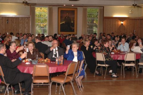 1985 Ford Crown Victoria LTD - A wedding reception is in full swing with guests enjoying drinks and conversation.