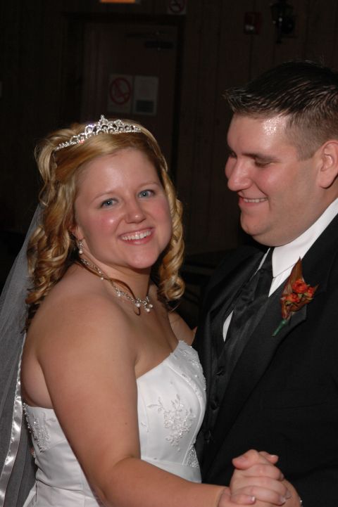 1985 Ford Crown Victoria LTD - A bride and groom share a moment on the dance floor during their wedding reception.