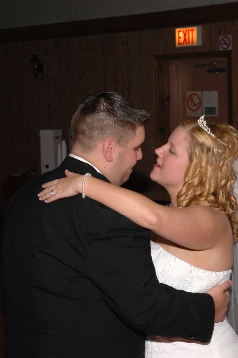 1985 Ford Crown Victoria LTD - Newlyweds share a dance at their wedding reception.