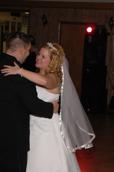 1985 Ford Crown Victoria LTD - A bride and groom share a dance during their wedding reception.