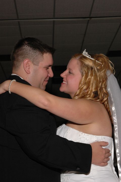 1985 Ford Crown Victoria LTD - A bride and groom share a moment on the dance floor during their wedding reception.