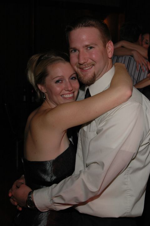 1985 Ford Crown Victoria LTD - A couple embraces while dancing at a wedding celebration.