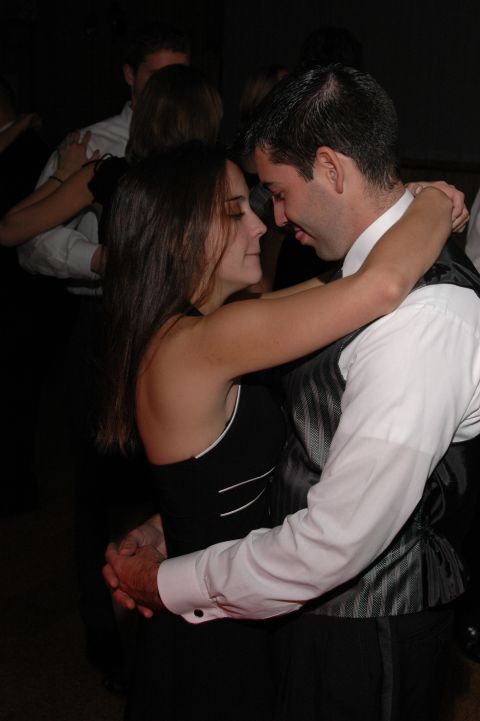 1985 Ford Crown Victoria LTD - A couple dances together at a formal event.