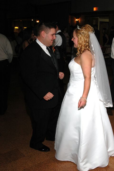 1985 Ford Crown Victoria LTD - A wedding couple shares a moment on the dance floor.