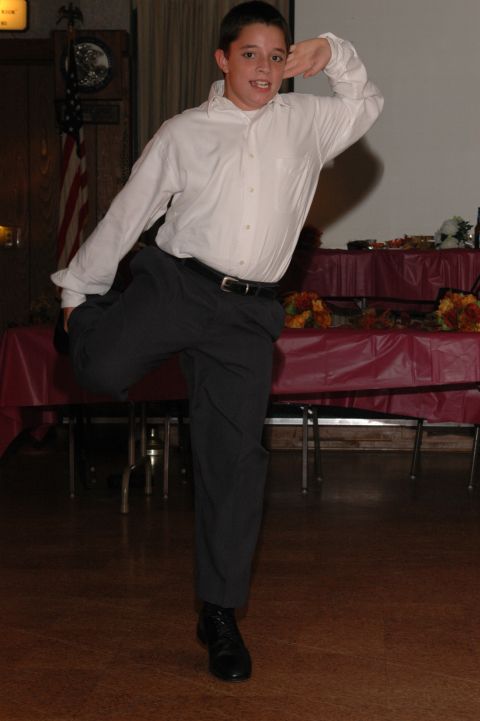 1985 Ford Crown Victoria LTD - A young boy strikes a pose while dancing at an event.