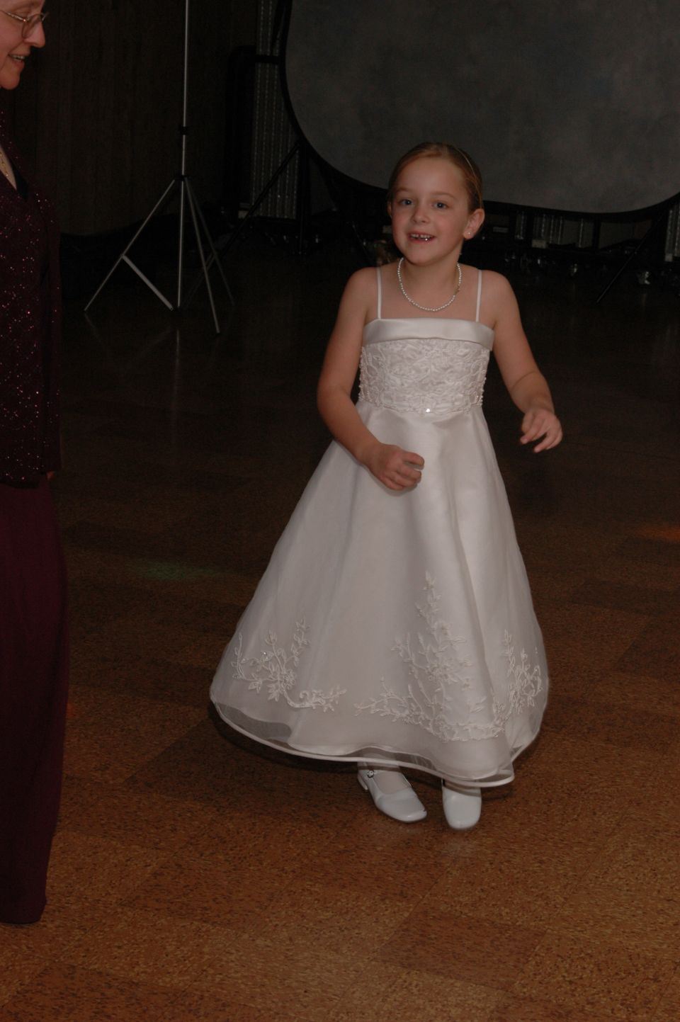 Girl in a white dress with a pearl necklace