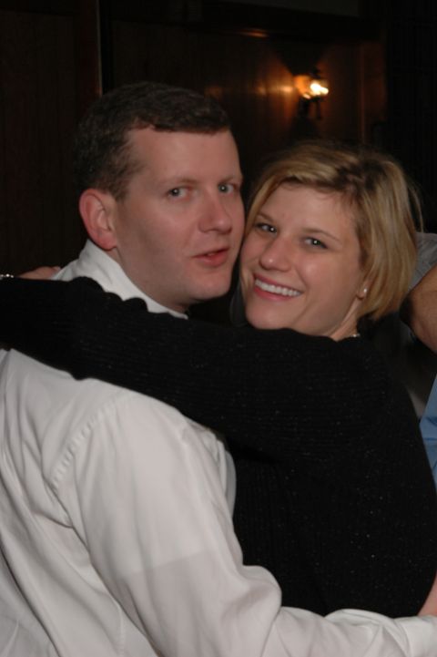 Couple embracing, man in white shirt, woman in black sweater