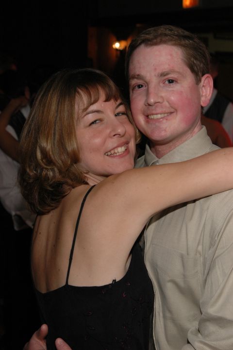 Couple embracing at an event