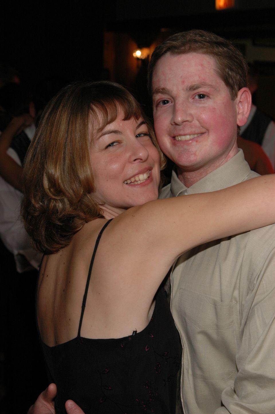 Couple embracing at an event