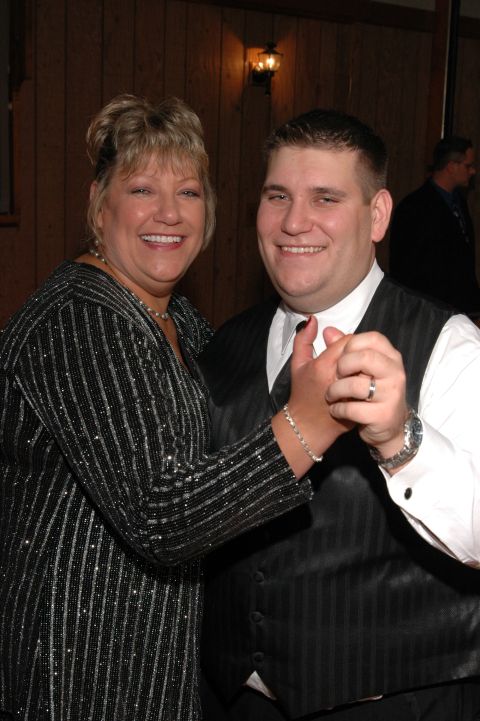 Woman and man dancing, both smiling