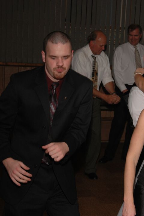 People in formal wear dancing indoors