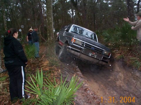 1992 Ford Bronco - A 1992 Ford Bronco navigates a challenging muddy off-road course.