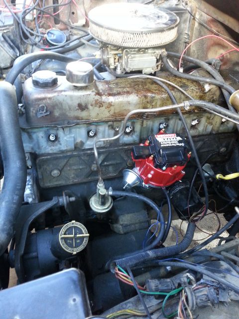 1981 Ford Bronco - Close-up view of an engine bay, showing the carburetor and distributor assembly.