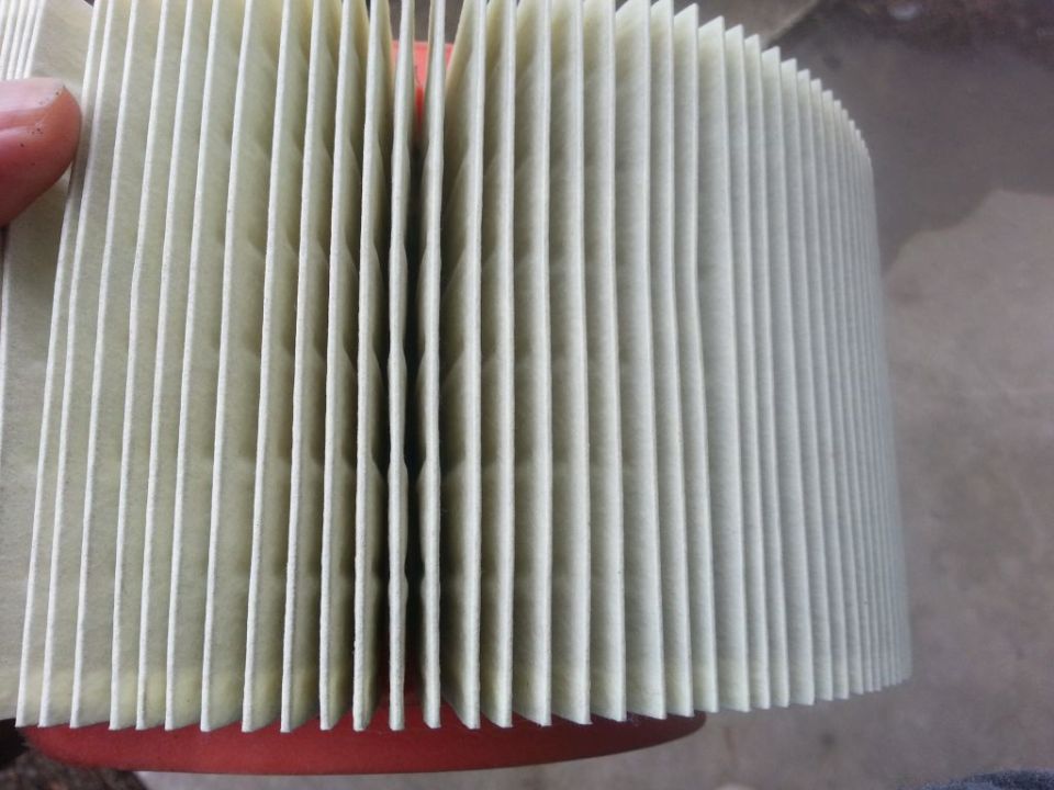Air filter with pleated paper element and red rubber seal