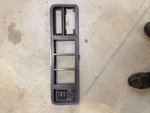 1996 Ford F-150 - This is a close-up of a vehicle's interior trim piece, likely for a dashboard or door panel.