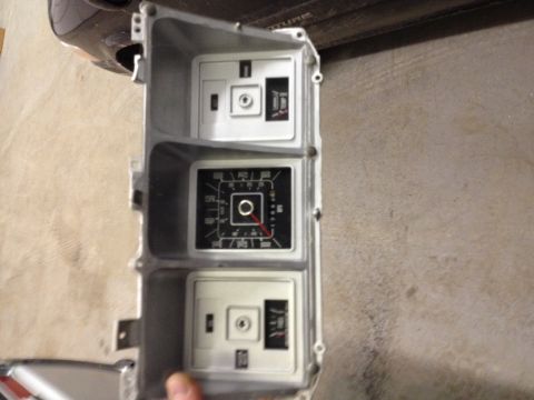 1996 Ford F-150 - Instrument cluster with a speedometer and two smaller gauges, part of a vehicle's dashboard.