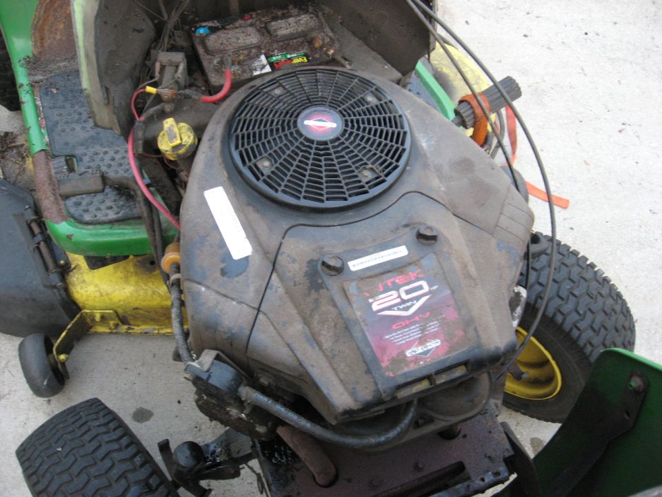 Briggs & Stratton Intek 20 HP V-twin exposed in green riding mower, hood removed