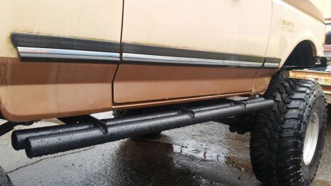 1988 Ford Bronco - This lifted 1988 Ford Bronco features prominent running boards and aggressive off-road tires.