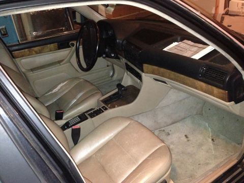 1988 BMW 7 Series - Interior view of a 1988 BMW 7 Series, highlighting the dashboard and seating area.