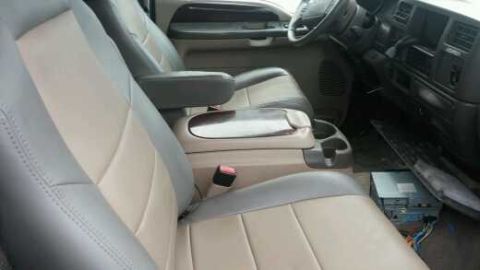 2003 Ford Excursion - Interior view of a 2003 Ford Excursion, highlighting the front seating area and dashboard.