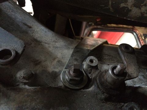 1978 Ford Bronco - The photo shows a close-up of a vehicle's transmission linkage, with a Ford logo embossed on the casing.
