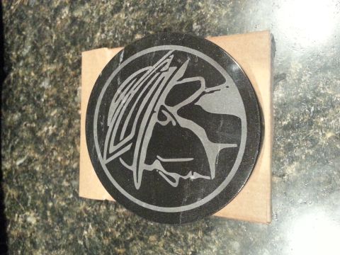 2003 Mercury Marauder - This is a close-up of a Mercury Marauder emblem, likely a replacement part or collectible item.