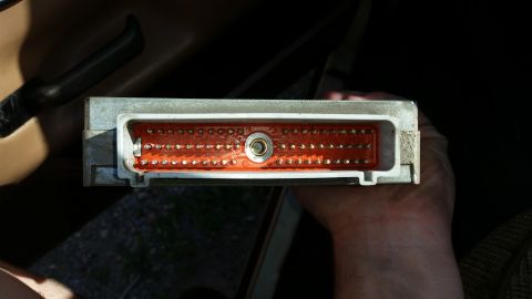 1991 Ford F-250 - Close-up of an engine control module connector, showing its intricate pin arrangement.