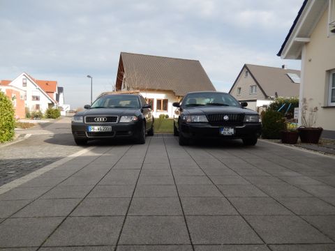 2003 Mercury Marauder - A black 2003 Mercury Marauder is parked in a driveway next to an Audi sedan.