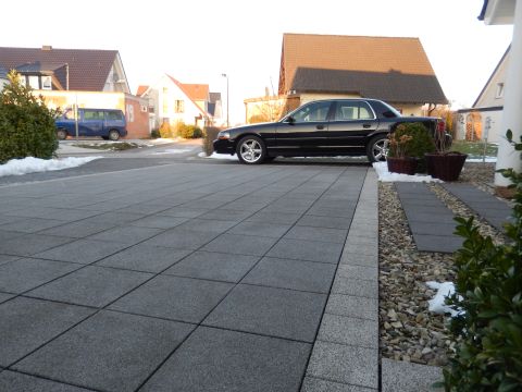 2003 Mercury Marauder - A black 2003 Mercury Marauder is parked in a paved driveway with houses in the background.
