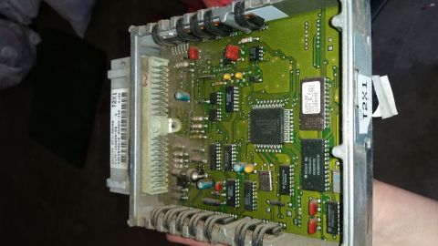 1991 Ford F-250 - Engine control unit circuit board with visible chips and connectors.