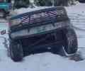 1988 Ford Bronco - A 1988 Ford Bronco is seen from the front, partially covered in snow.