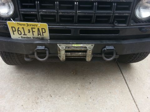 1987 Toyota 4Runner - Front view of a vehicle's bumper, a winch and tow hooks.