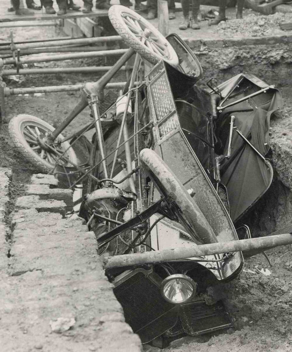 1915 Ford Model T overturned in a ditch, side view