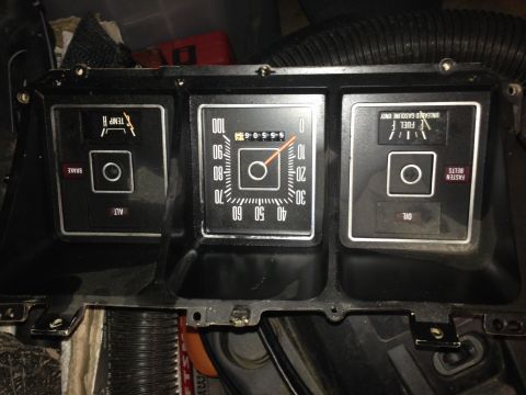 1979 Ford Bronco - This instrument cluster, likely from a 1979 Ford Bronco, features gauges for temperature, oil, and fuel, along with a speedometer and odome…