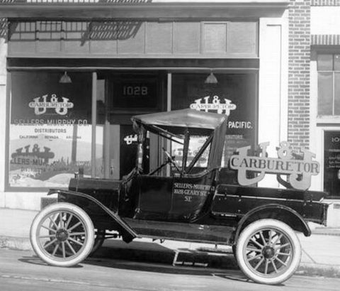 1915 Ford Model T - A 1915 Ford Model T truck is parked outside Sellers-Murphy Co. distributors.