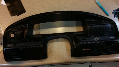 1995 Ford Bronco - Dashboard trim panel with a carbon fiber finish, likely a replacement part.