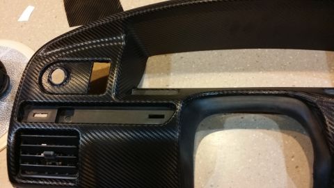 1995 Ford Bronco - Dashboard trim panel with carbon fiber vinyl wrap applied.