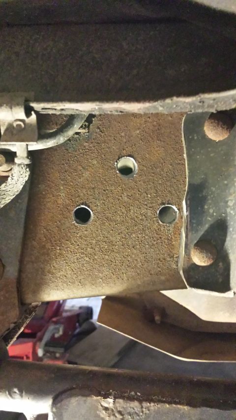 1996 Ford Bronco - Holes drilled now to clean up the surface rust a bit. I so love drilling into the frame rail.. :/ You can also see where the body mount has…
