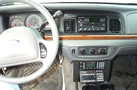 1991 Ford LTD Crown Victoria - Dashboard and interior of a Ford Crown Victoria, equipped with police radio scanners.