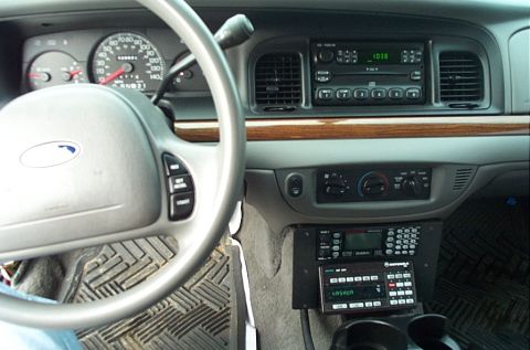 1991 Ford LTD Crown Victoria - Gray interior dash view of a Ford Crown Victoria from the driver's seat, showing the airbag steering wheel with cruise buttons, 140 mph spe…