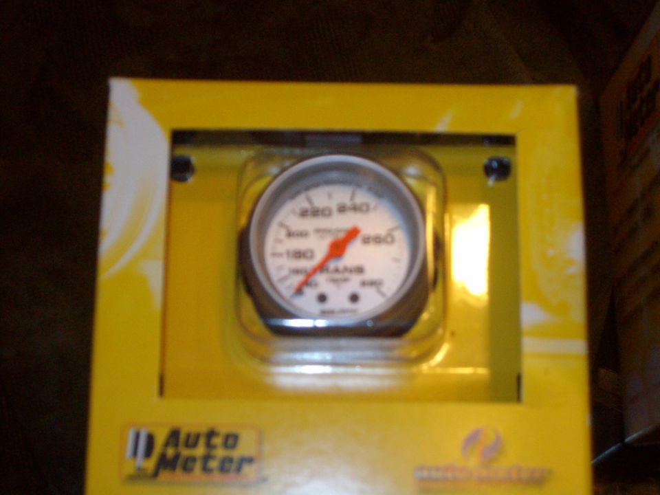 Auto Meter gauge in yellow box, showing temperature readings