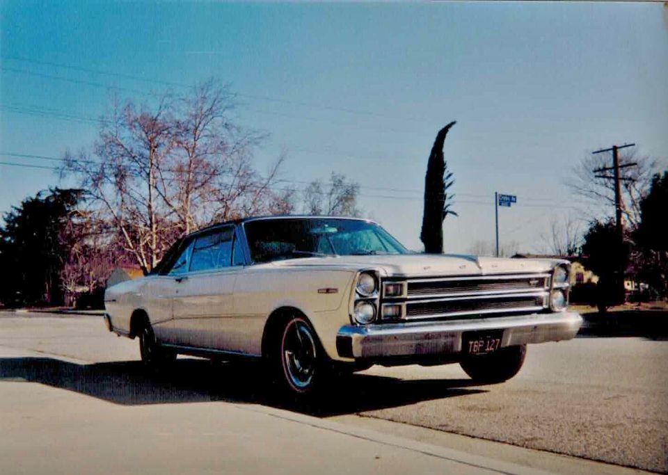 White 1967 Ford Galaxie parked on a street. License plate reads TBP 127
